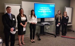 Students from Finlandia University's THE Project team pose for a photo in Grand Rapids at the competition.