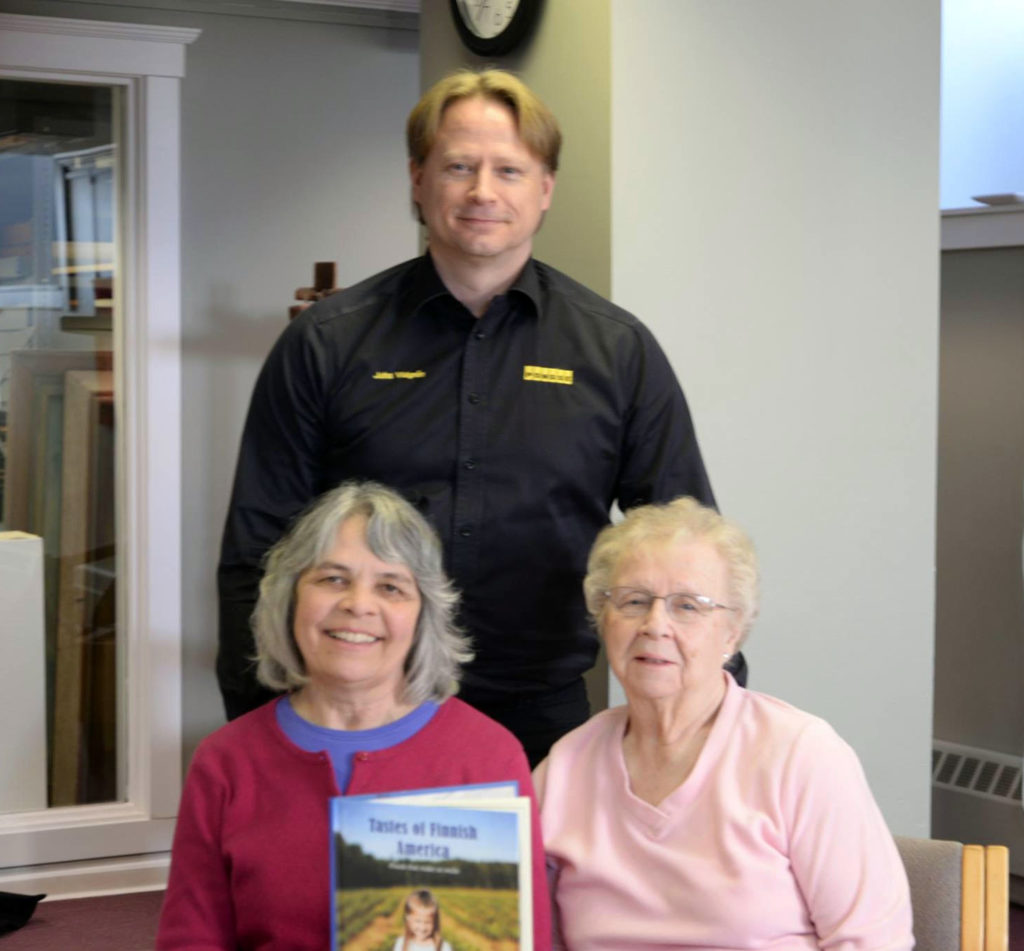 Juha Vidgrén with Marja Kilpelä (left) and Hazel Tepsa, who contributed recipes to the book. 