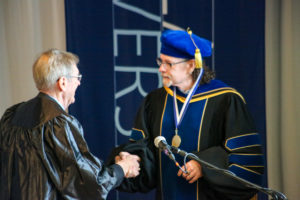 Dr. Richard Gee receiving 2022 Distinguished Faculty Award