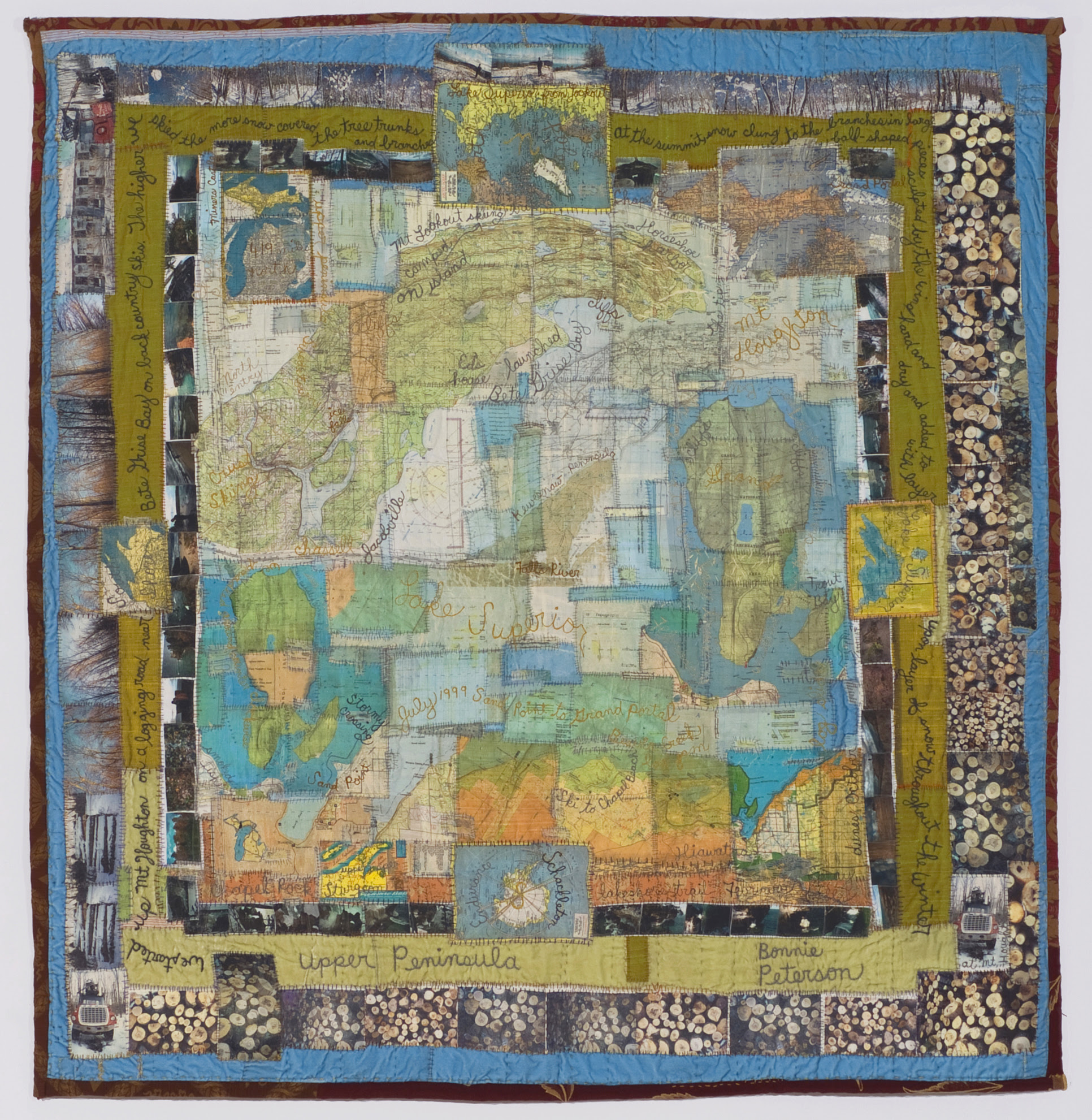 Bonnie Peterson, Upper Peninsula, 50" H x 48" W, Embroidery and heat transfers of upper Michigan and Lake Superior maps, painted and embroidered with stories from ski and kayak trips, photographs on silk, satin, velvet and brocade, stitched.